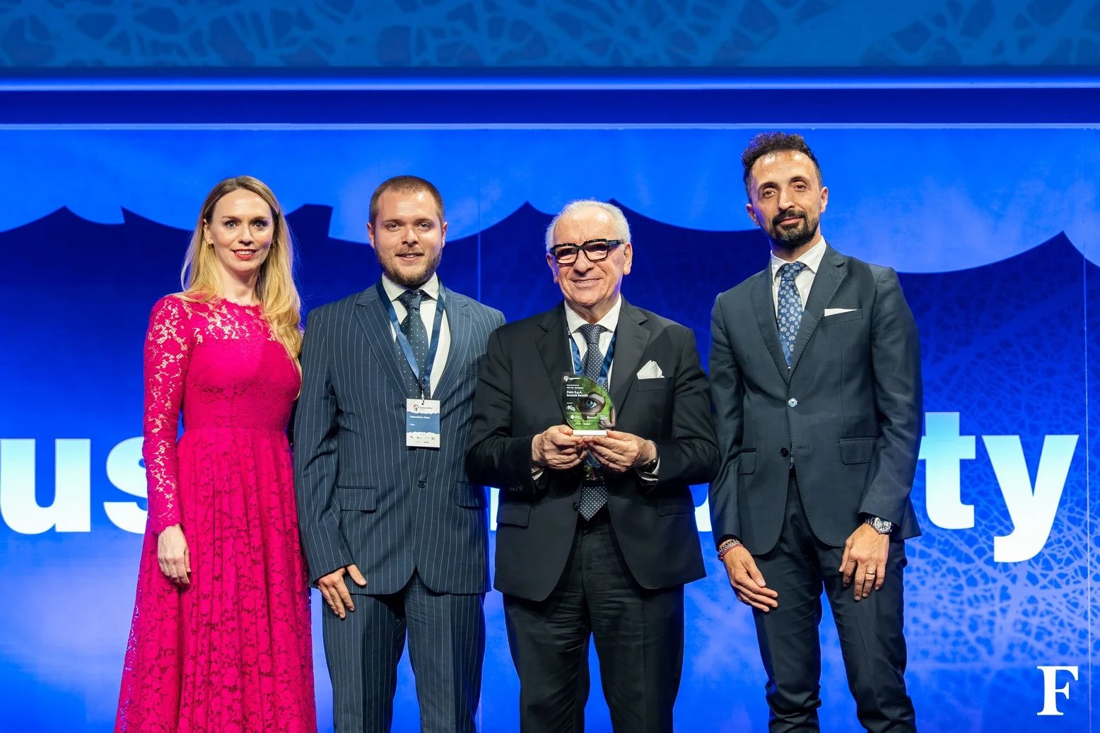 Award winners receiving their Sustainability Award 2026 trophy on stage in Milan